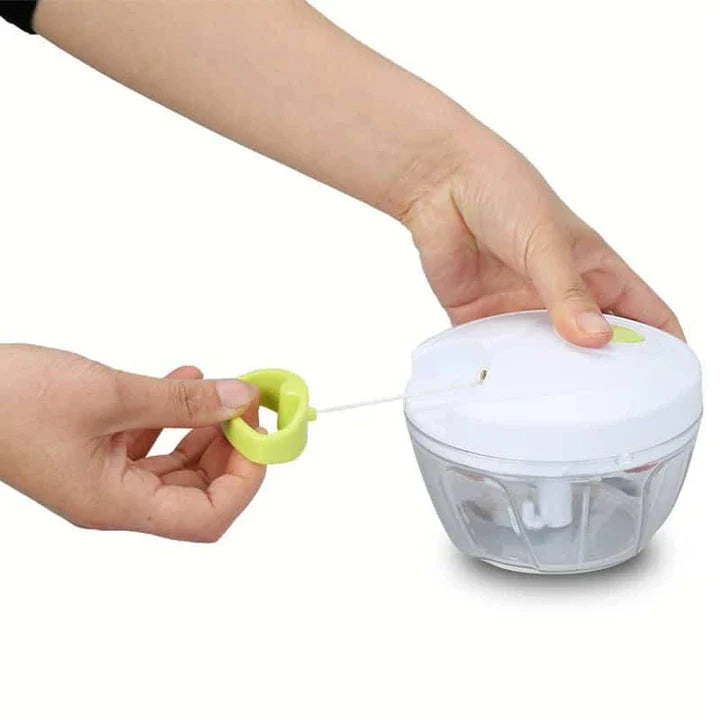 Portable Hand Pull Food Chopper with light green body and 3 sharp blades for easy chopping, slicing, and dicing in UK kitchens