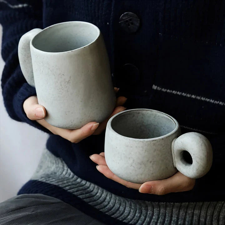 Elegant Japanese stoneware retro coffee mug in solid apricot and grey colours with comfortable handgrip shape