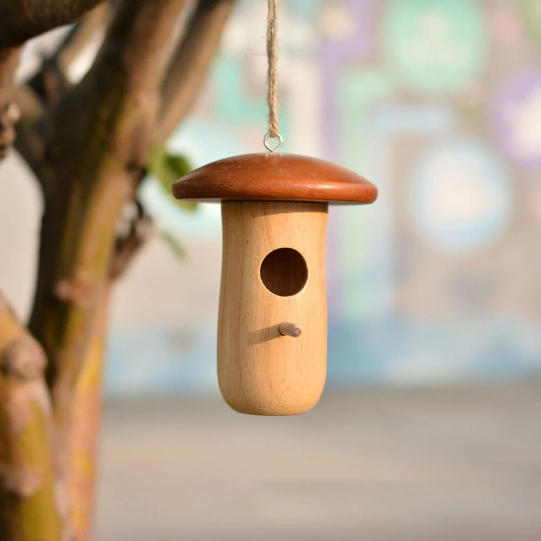 A charming wooden hummingbird nest designed for outdoor gardens, providing a safe and cozy home for these delightful birds.