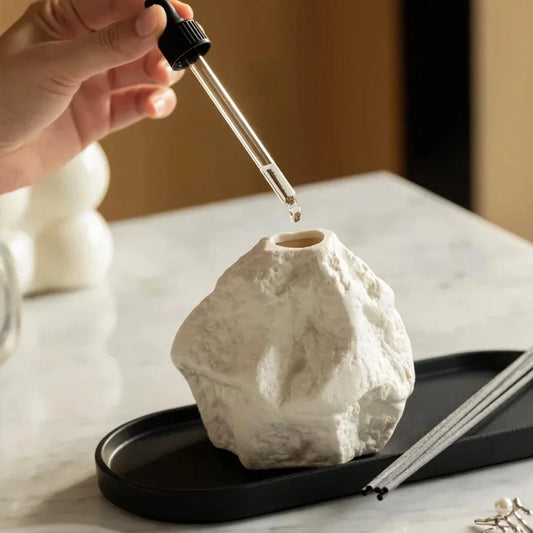 Elegant Nordic-style ceramic aromatherapy diffuser bottle with a modern, rock-inspired design