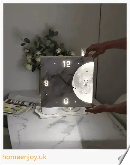 Elegant double-sided corner wall clock with acrylic construction and aluminium hands, providing a modern and minimalist aesthetic for British homes.