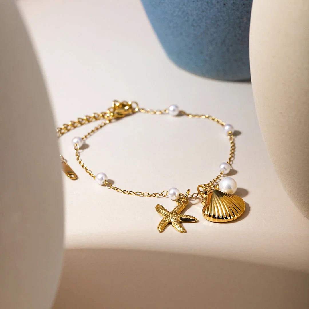 Elegant 18K gold-plated bracelet with a pearl starfish pendant on a snake bone chain