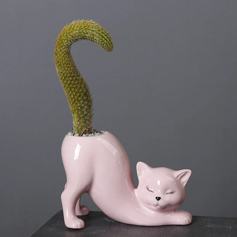 A charming cartoon cat-shaped flower pot made of high-quality glazed porcelain, perfect for adding a playful touch to your home or office decor.