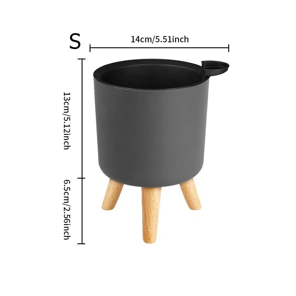 Modern self-watering planter with sleek wooden stand, available in small, medium, and large sizes