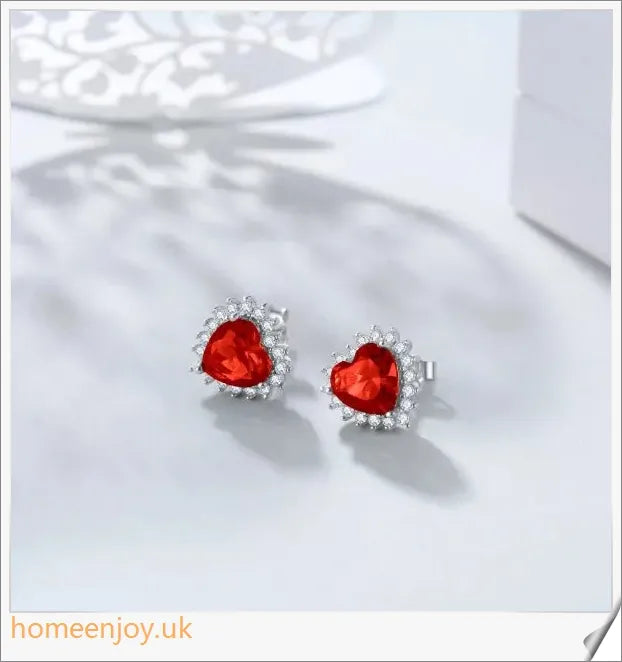 Elegant sterling silver earrings featuring a heart-shaped design and sparkling cubic zirconia stones