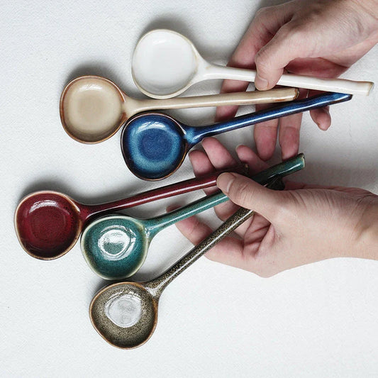 Elegant British ceramic soup spoon with long handle and vibrant glaze for refined dining experience