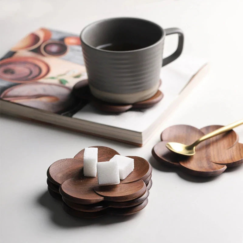 Set of elegant Japanese-inspired walnut wood flower coasters with unique textures and natural variations