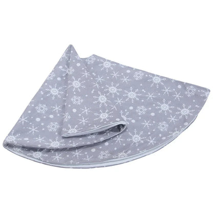 Grey background with intricate white snowflake design Christmas tree skirt