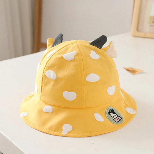Adorable cow-patterned kids' bucket hat made of soft, breathable cotton for comfortable outdoor wear