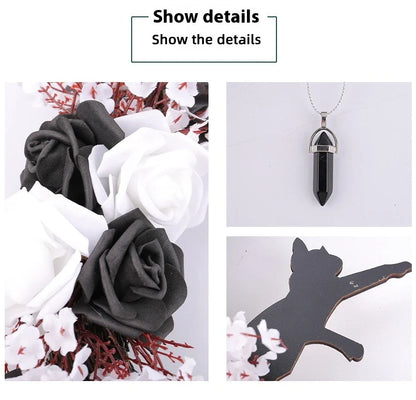 Spooktacular Halloween garland featuring a blend of dried white flowers, black roses, and mystical moon cat ornaments