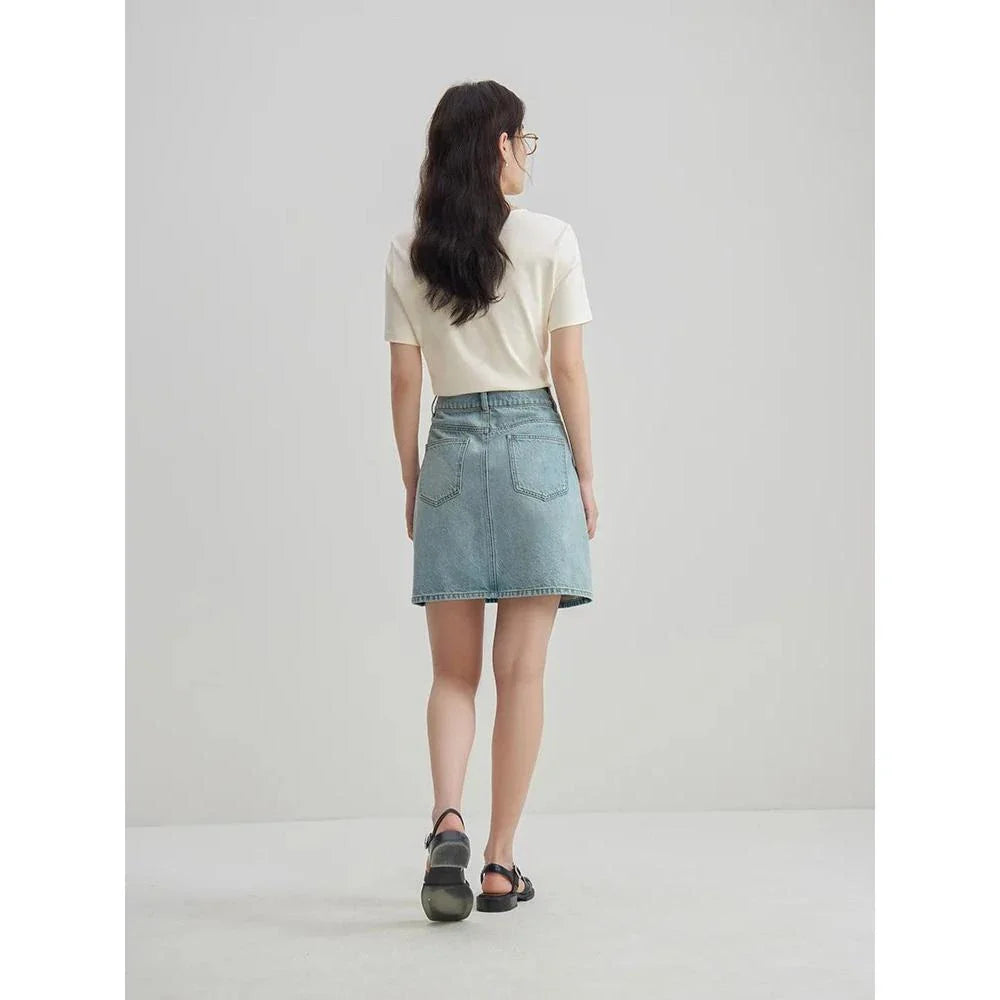 Chic high-waisted denim skirt in a classic blue shade, featuring an A-line silhouette and a flattering empire waistline.