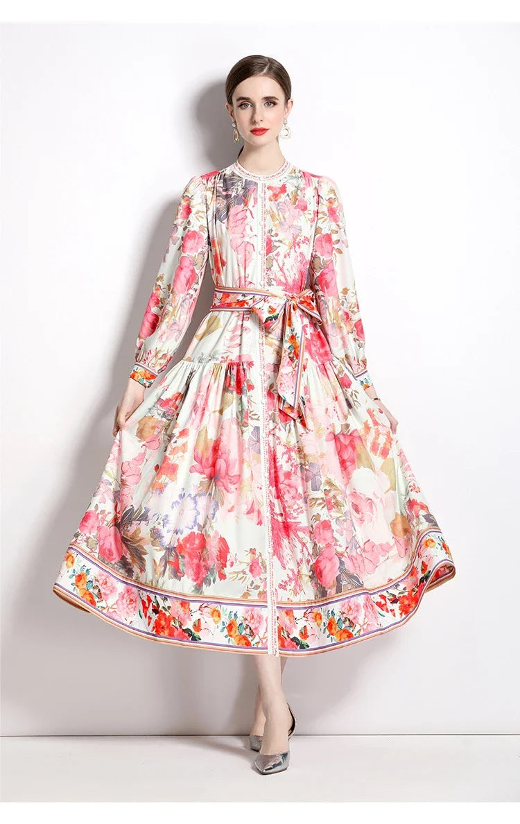 Elegant floral single-breasted swing dress with delicate print, tailored design, and flowing silhouette