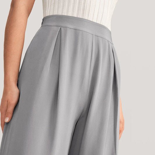 Chic silk wide-leg trousers in a sophisticated grey colour, featuring a high-waist design and relaxed fit for all-day comfort and style.