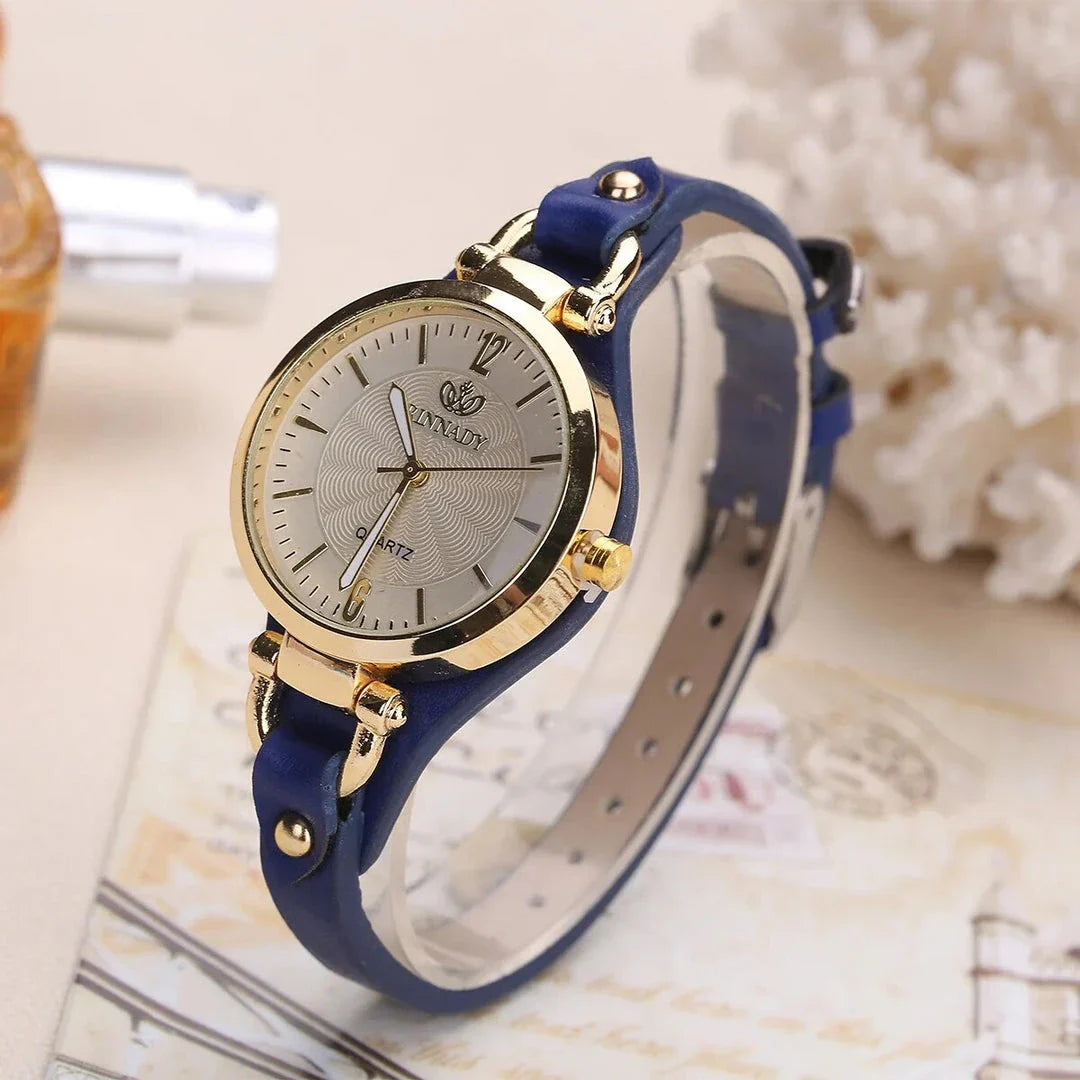 Elegant women's quartz watch with a black leather strap, featuring a sleek alloy case and a durable glass dial window
