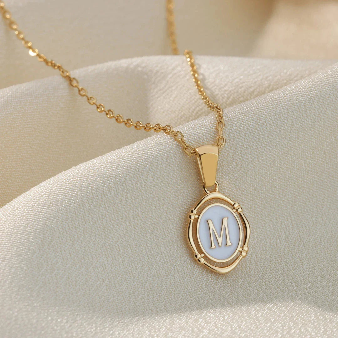 Elegant gold-tone letter pendant necklace with innovative drip oil design and integrated fitness tracker