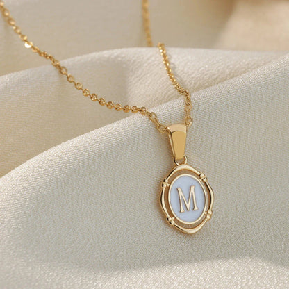 Elegant gold-tone letter pendant necklace with innovative drip oil design and integrated fitness tracker