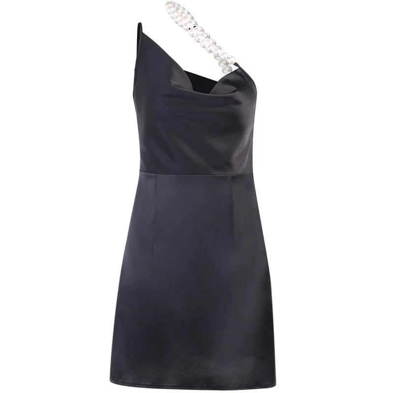 Elegant irregular French halter skirt with pearlescent accents, featuring a unique collage-inspired pattern and a flattering oblique shoulder design