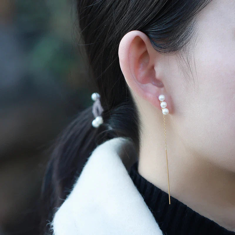 Elegant natural pearl earrings in a sleek silver frame, a timeless accessory for any occasion