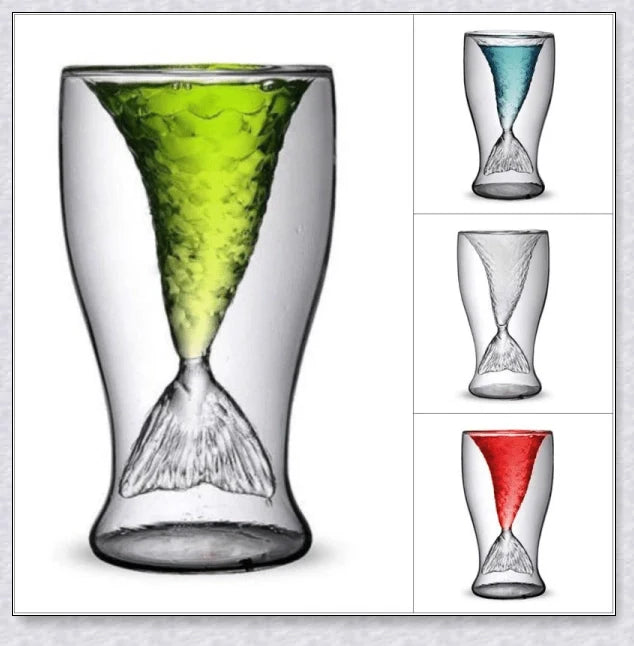 A transparent glass mug with a decorative mermaid tail design, perfect for enjoying a range of beverages in style.