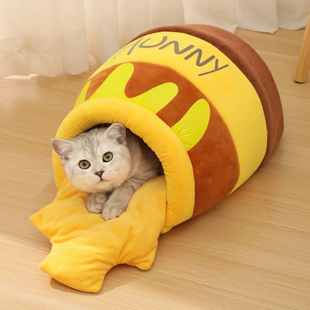 Cosy honey pot-shaped cat bed made of plush velvet material for comfort and warmth