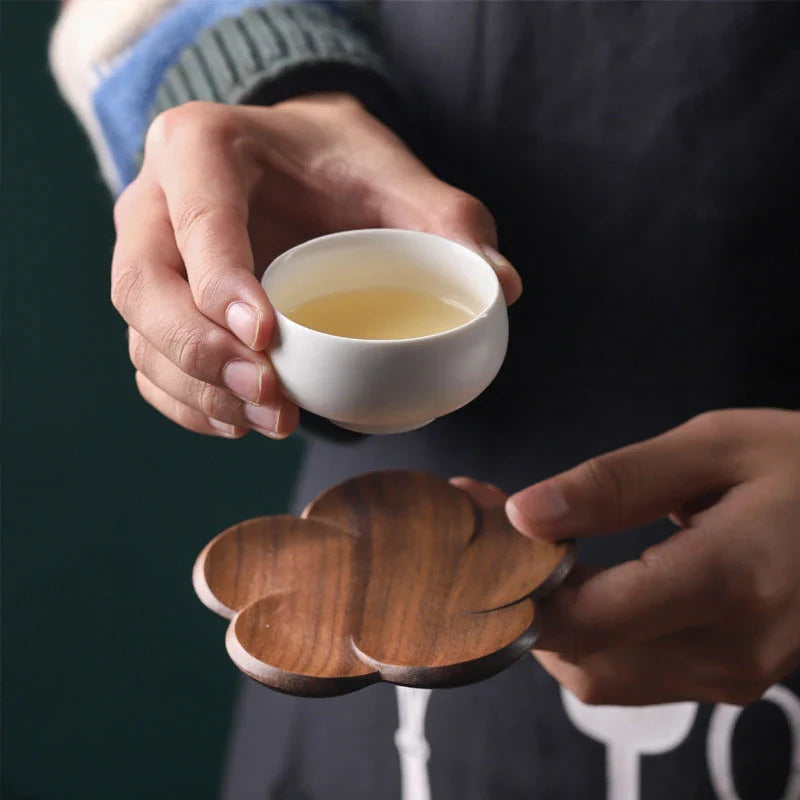 Set of elegant Japanese-inspired walnut wood flower coasters with unique textures and natural variations