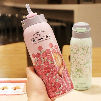 Elegant floral-patterned double-wall insulated water bottle with straw, perfect for keeping drinks chilled or warm for up to 12 hours