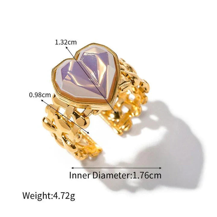 Adjustable stainless steel ring with a mermaid-inspired heart design and shell beads, a unique and versatile accessory.