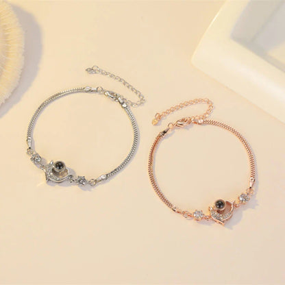 Couple wearing vibrant, projection couple bracelets in rose gold and platinum finishes