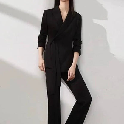 Elegant vintage-inspired two-piece office suit with tailored blazer and high-waisted trousers in premium polyester fabric