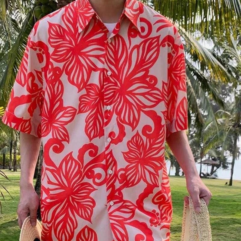 A stylish red short-sleeve shirt with a retro vine print pattern, perfect for casual British-inspired fashion.