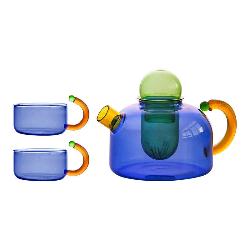 Elegant glass teapot and teacup set in vibrant contrasting colours, designed for a refined tea experience