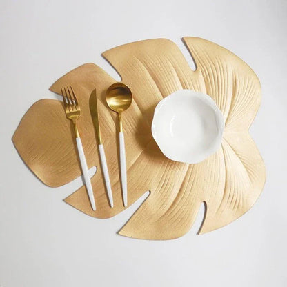 Elegant floral-patterned PVC dining table coaster in a contemporary setting, protecting a wooden table surface