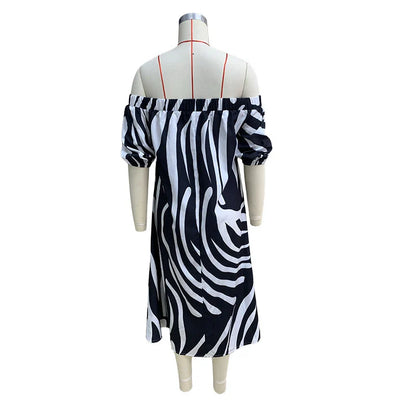 Elegant floral-print off-shoulder midi dress in black, showcasing a feminine A-line silhouette and premium polyester construction