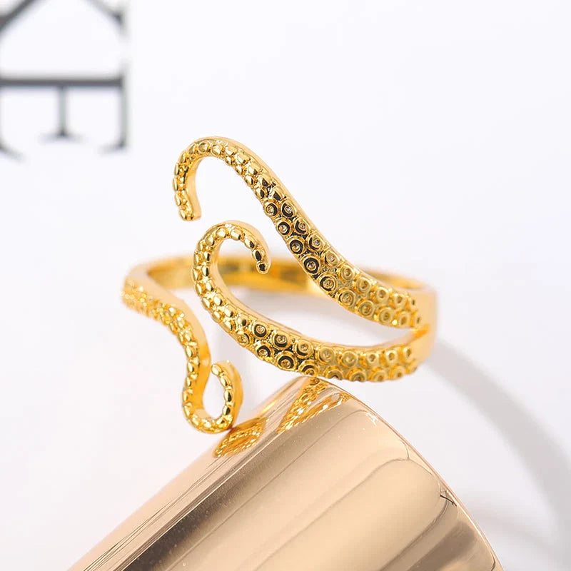 Elegant adjustable wrap ring with a detailed octopus tentacle design, made from durable stainless steel.