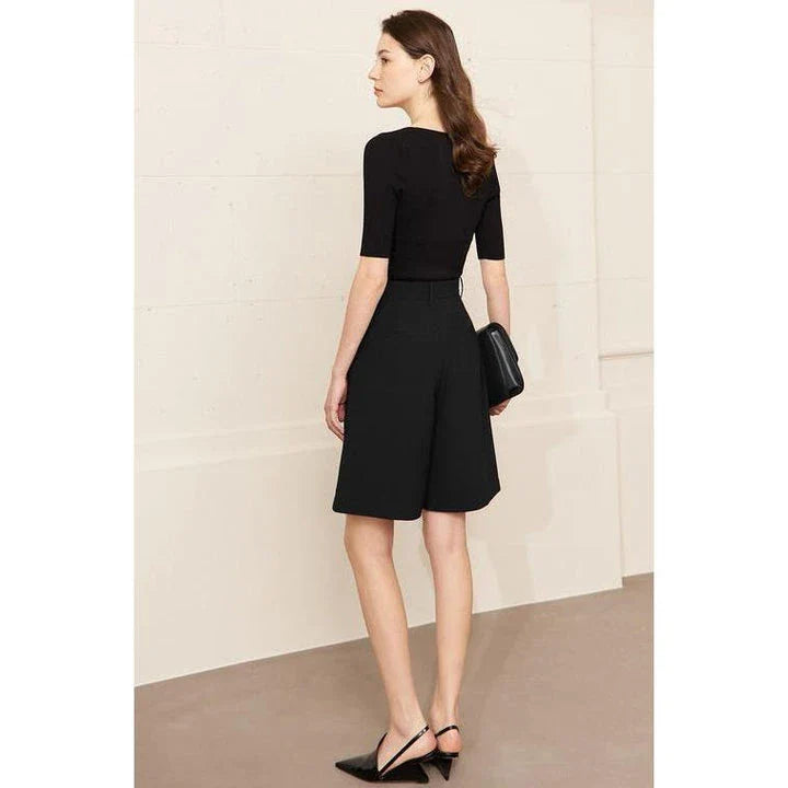 Elegant wide-leg shirred shorts in deep blue, designed for the modern British woman