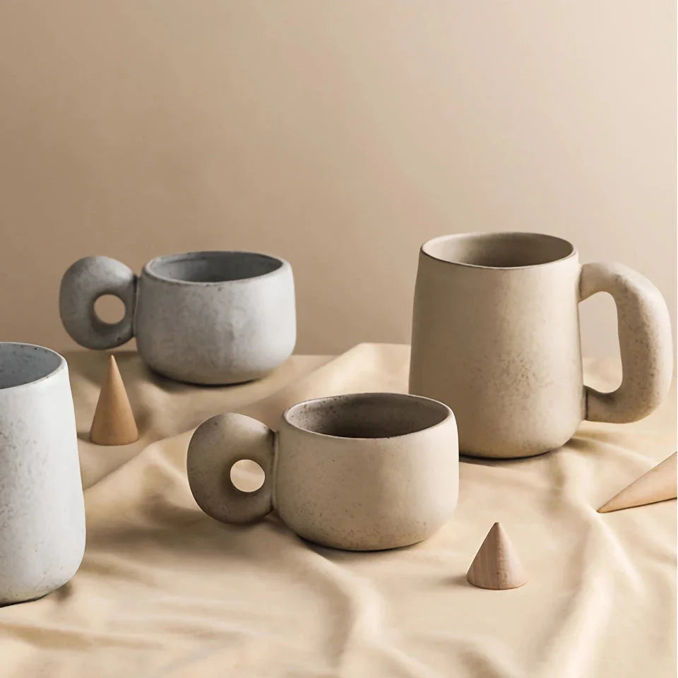 Elegant Japanese stoneware retro coffee mug in solid apricot and grey colours with comfortable handgrip shape