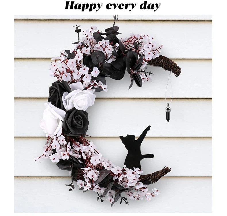 Spooktacular Halloween garland featuring a blend of dried white flowers, black roses, and mystical moon cat ornaments