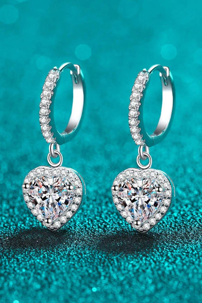 A pair of elegant moissanite heart-shaped drop earrings with a brilliant 2-carat display, crafted in 925 sterling silver with rhodium plating and zircon accents.