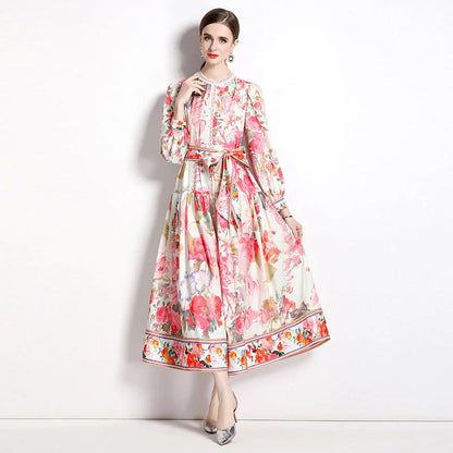 Elegant floral single-breasted swing dress with delicate print, tailored design, and flowing silhouette
