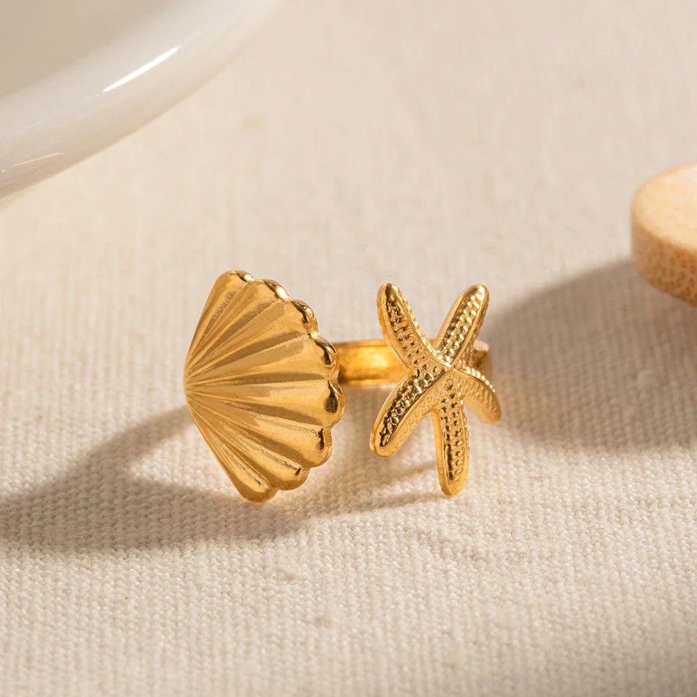 Adjustable stainless steel ring with starfish and shell accents, perfect for beach and casual wear