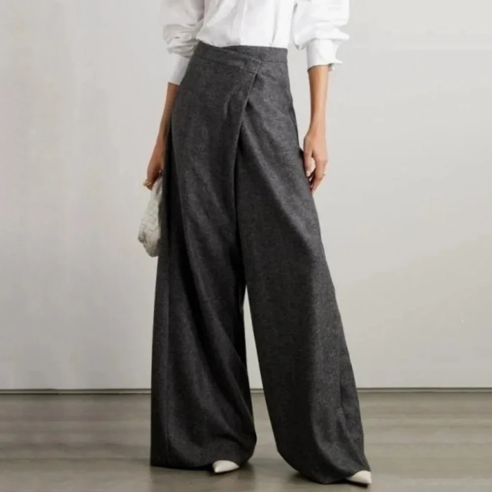Elegant woollen wide-leg trousers in a high-waist design with unique asymmetric detailing, perfect for the discerning British woman.