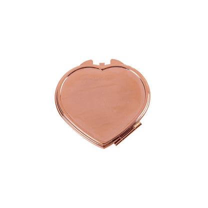 Heart-shaped metal pill box with built-in mirror for convenient storage and touch-ups on the go