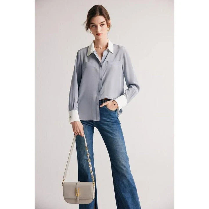 A chic and elegant silk crepe de chine blouse in a timeless solid pattern, perfect for professional and casual wear.
