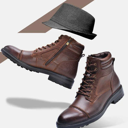 A pair of durable, stylish cowhide leather men's boots in a classic British design