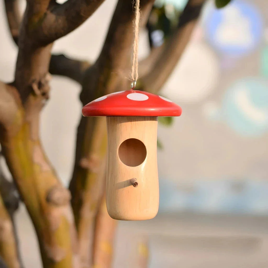 A charming wooden hummingbird nest designed for outdoor gardens, providing a safe and cozy home for these delightful birds.