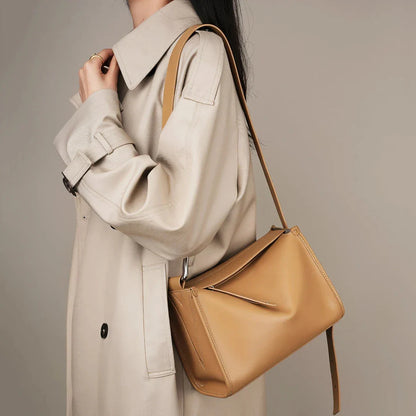 Genuine leather shoulder bag with soft, pillow-like shape and secure zipper closure