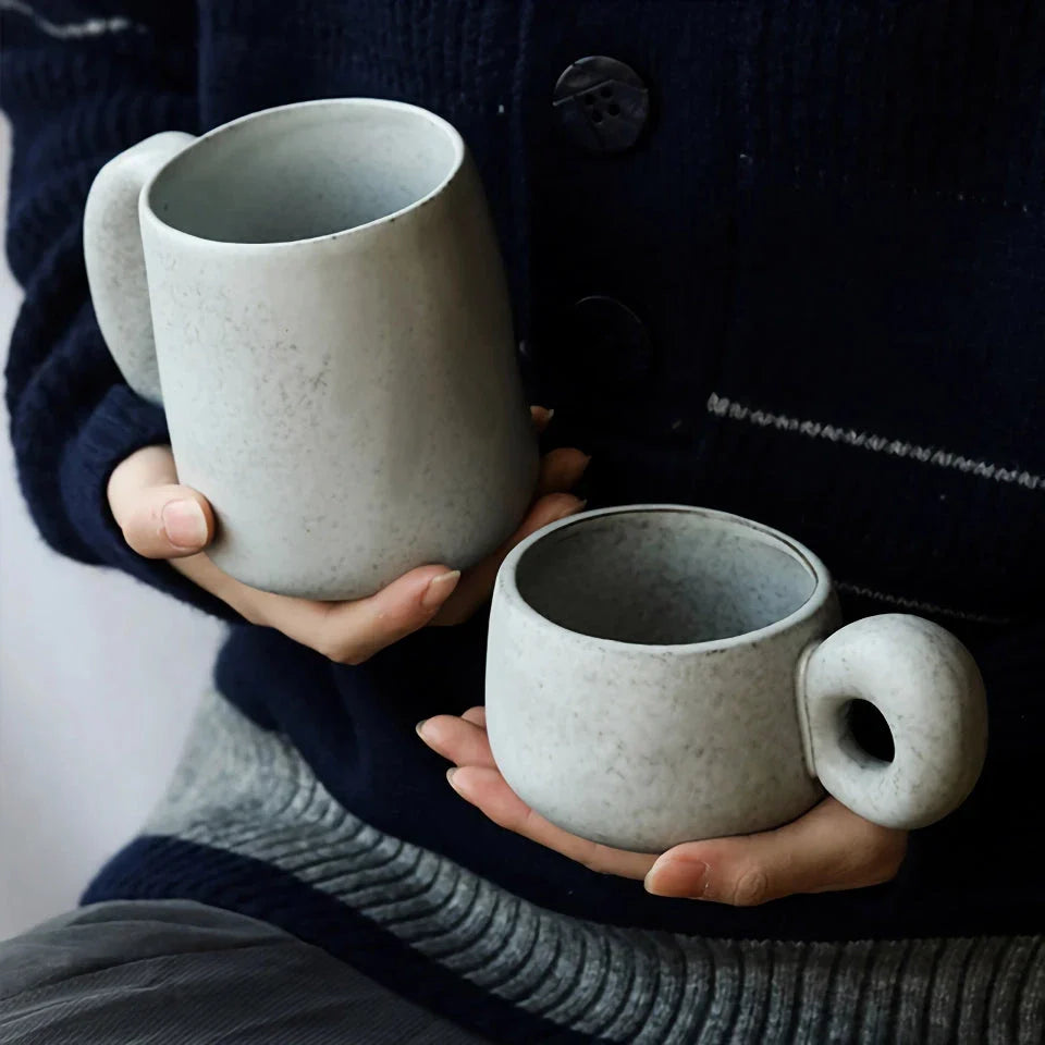 Elegant Japanese stoneware retro coffee mug in solid apricot and grey colours with comfortable handgrip shape