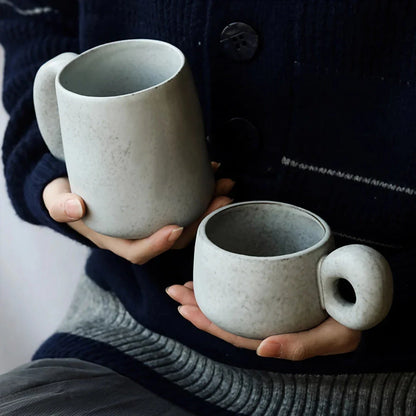 Elegant Japanese stoneware retro coffee mug in solid apricot and grey colours with comfortable handgrip shape