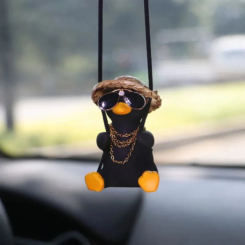 Charming swinging duck car accessory with guitar and coke-themed design, offering a unique and personalized driving experience
