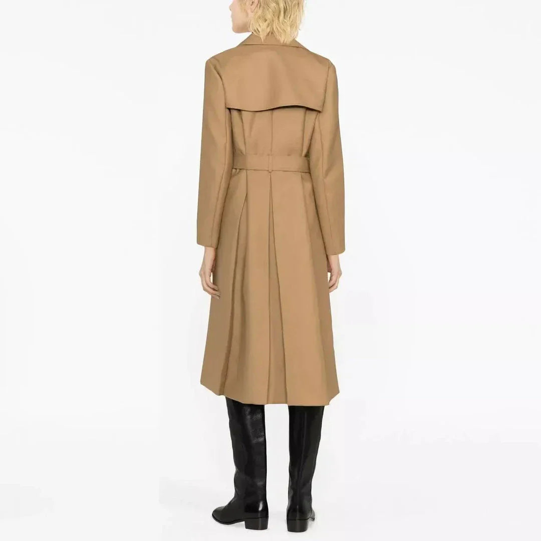 Elegant double-breasted women's trench coat in beige, featuring a classic collar, wide-waisted design, and practical pockets for a sophisticated and timeless look.